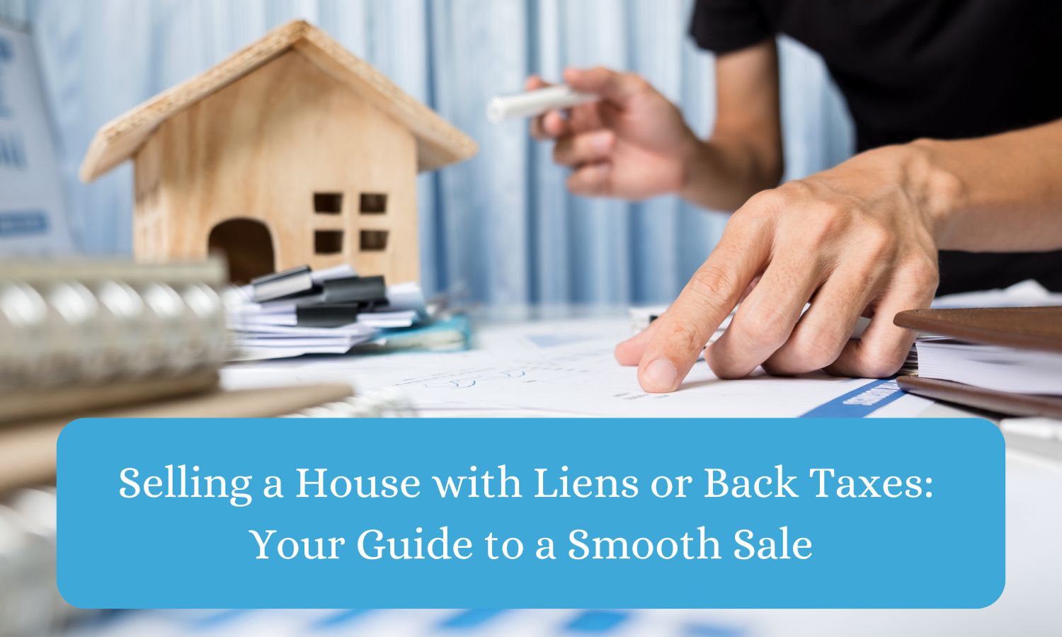 Person calculating a lien and back taxes with a small wooden house in the background.
